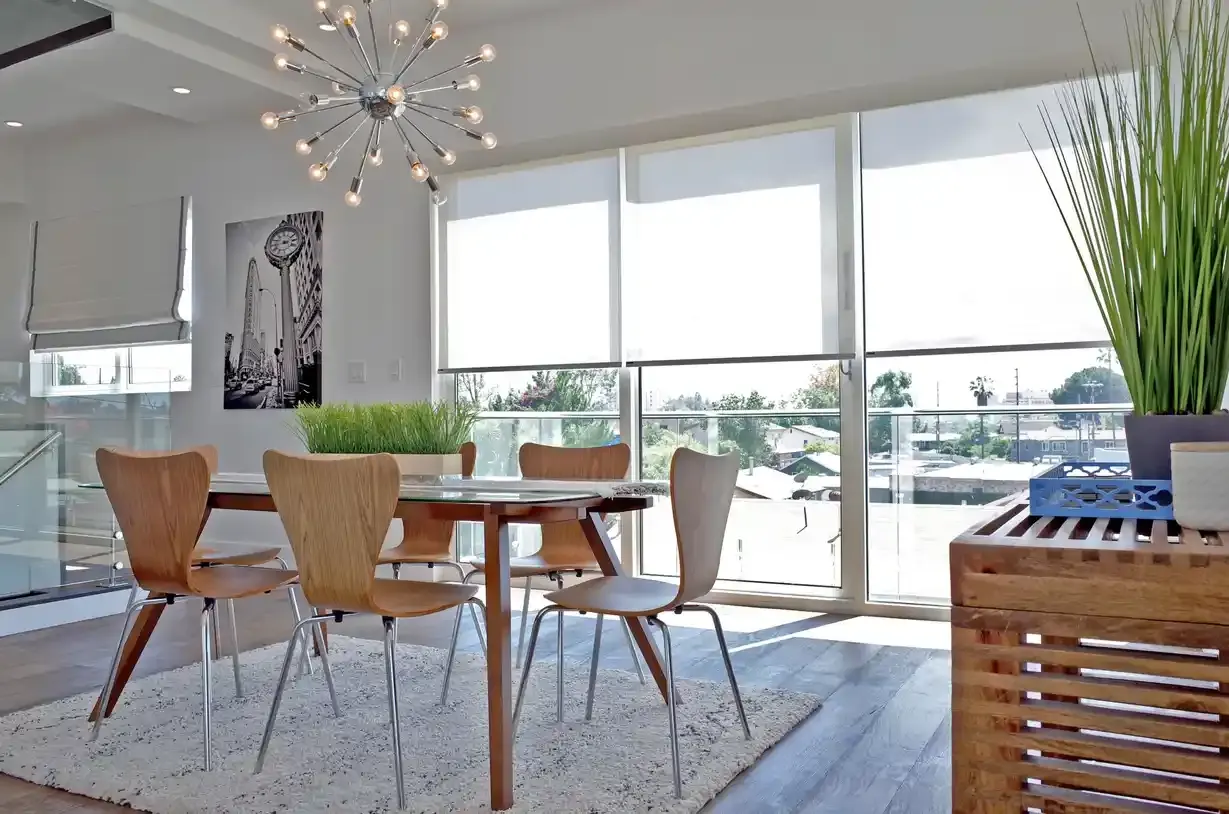 Elegant roller shades installed in a modern room Elegant roller shades installed in a modern room