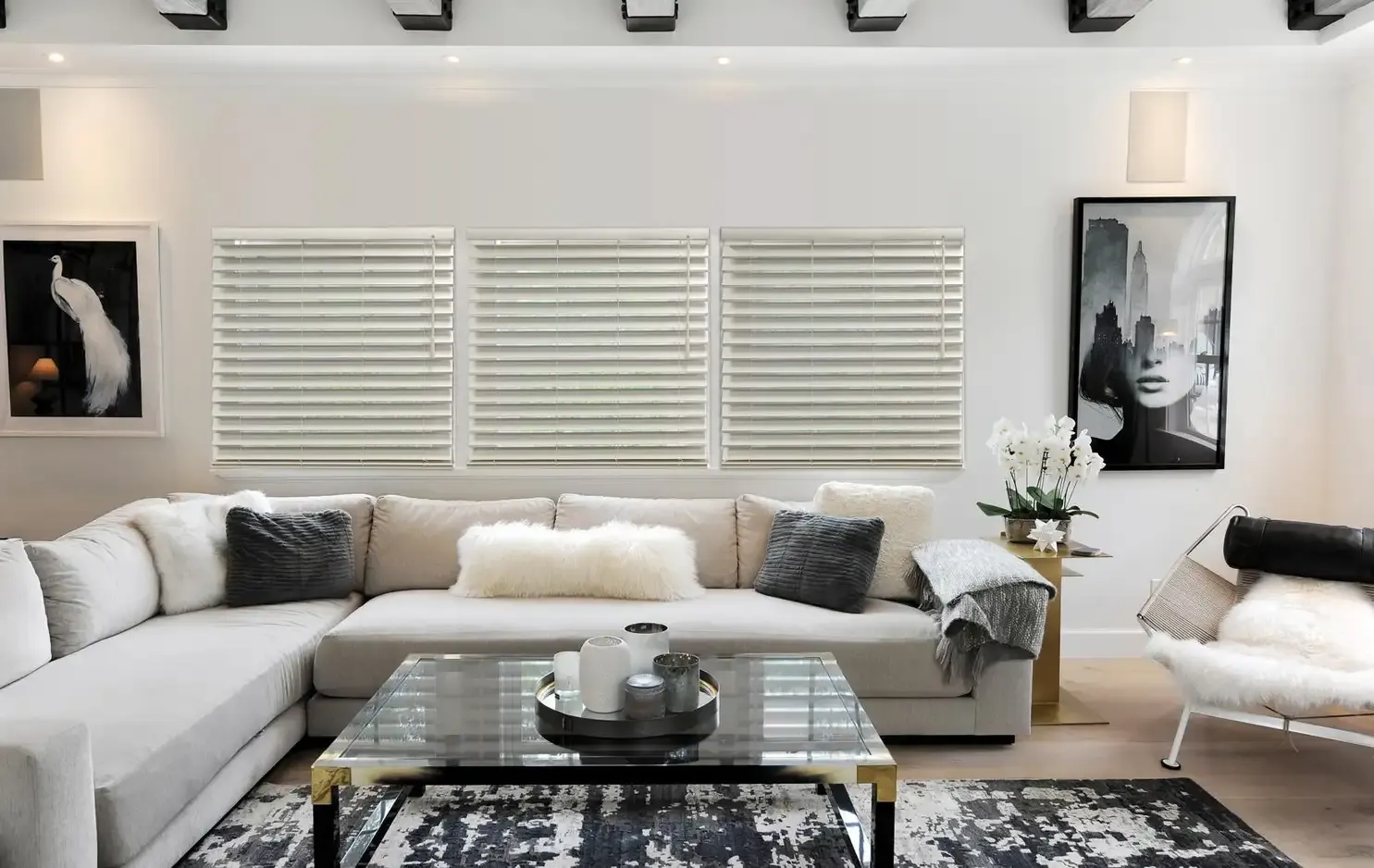 Two-inch faux-wood blinds in a guest bedroom with louvers tilted closed