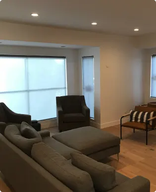Contemporary roller shade treatment in an open-plan kitchen