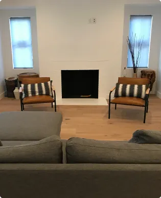 Layered window treatments bringing privacy and softness to a renovated room