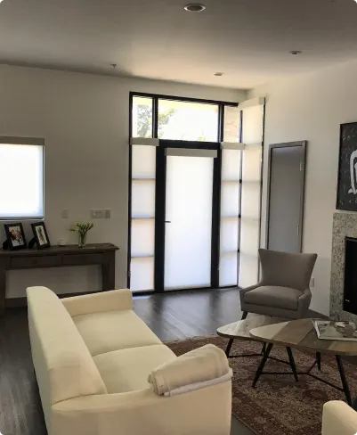 Full-height window covering designed for a two-story foyer