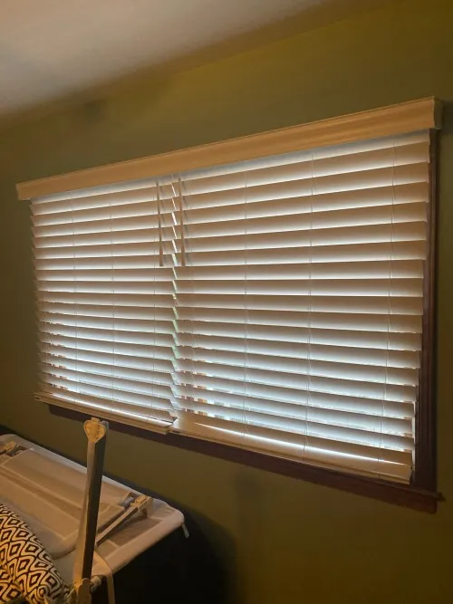 Minimalist roller shade keeping a home office window clean and uncluttered