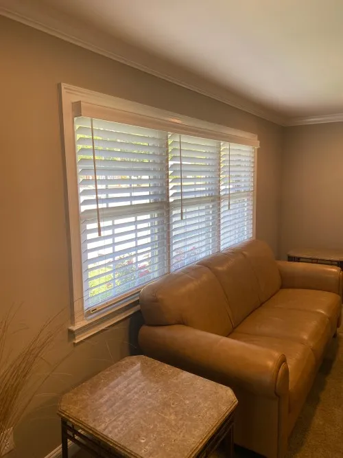 Layered shades and drapery completing a coordinated room design