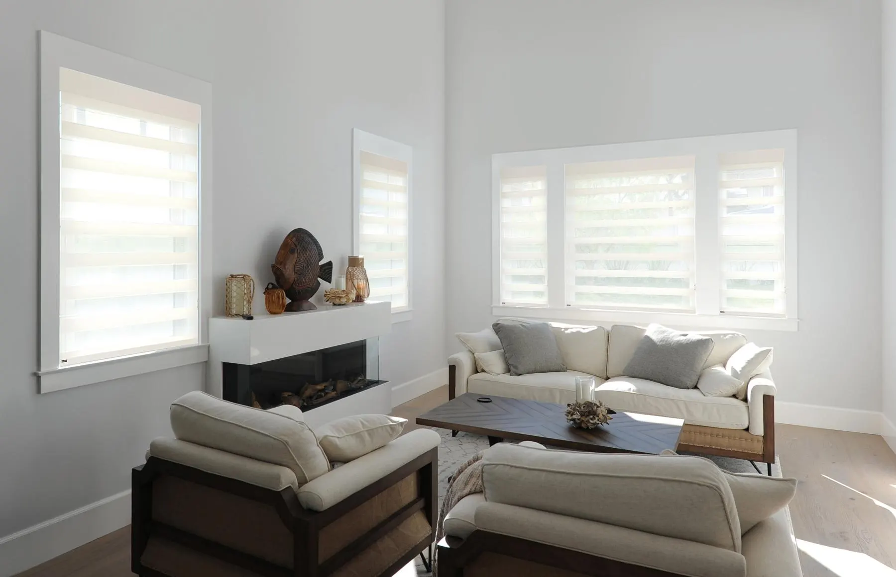 Roller shades raised to keep the room bright while preserving a simple profile