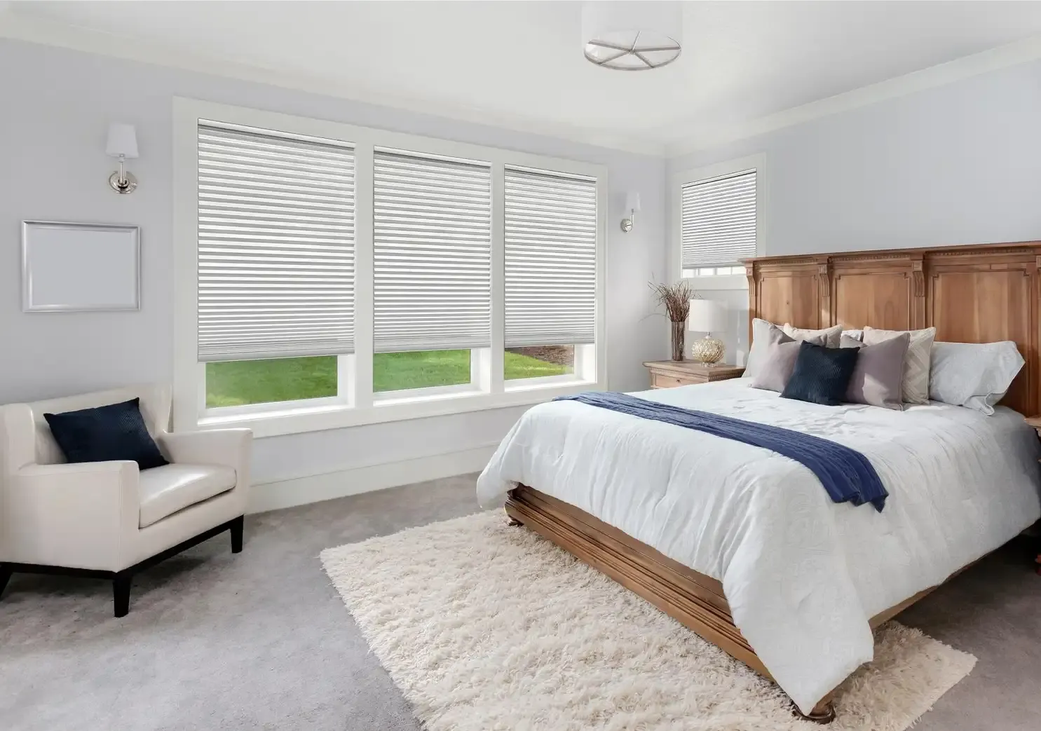 Cassette-mounted roller shades installed above a tall transom window