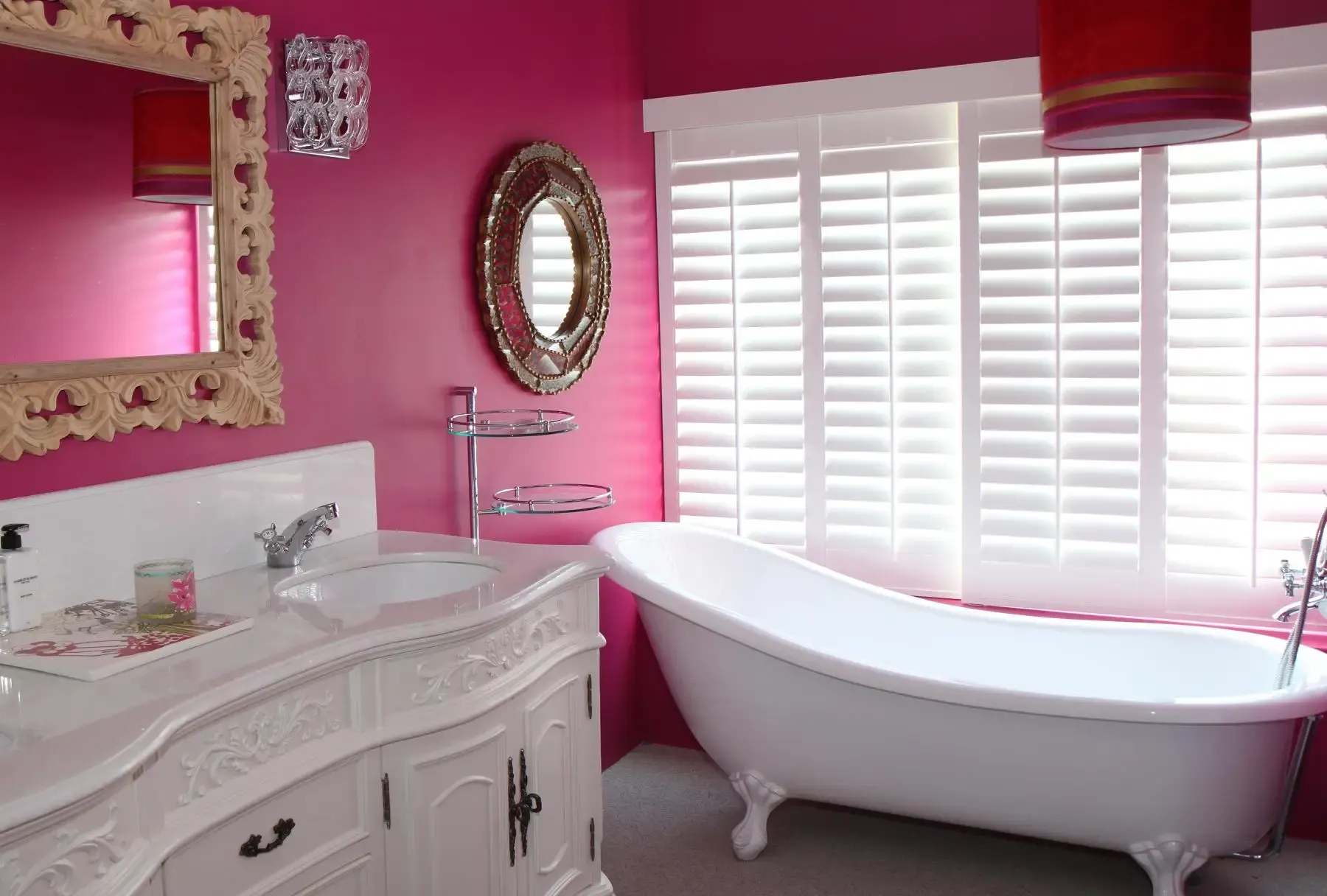 Cafe-style plantation shutters covering the lower half of a kitchen window